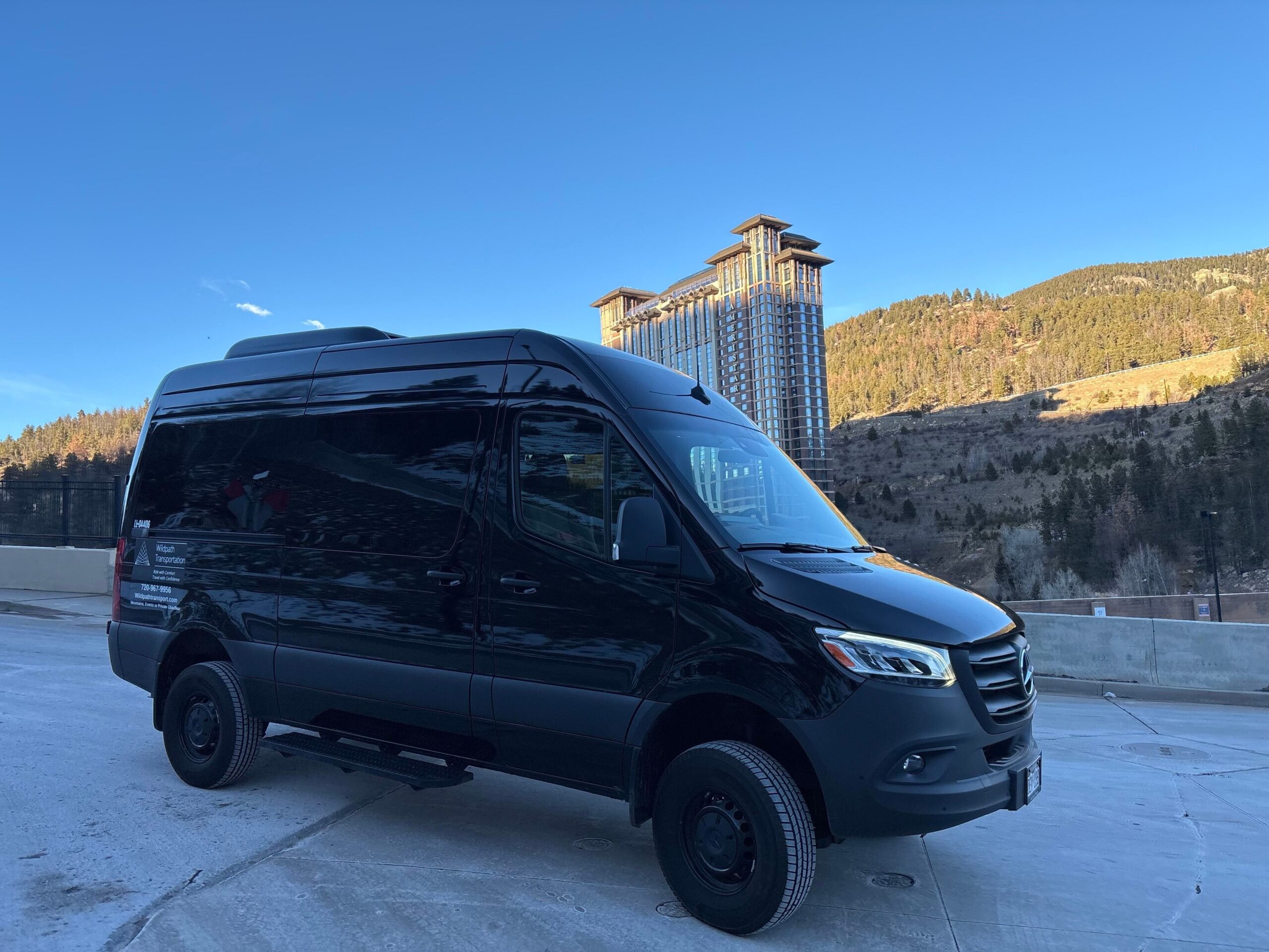 Black Mercedes Sprinter van from the WildPath Transportation fleet